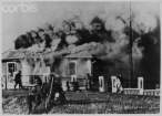 Nazi Soldiers Beside Burning Blockhouse in Yugoslavia, 1941.jpg