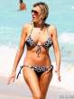 rita-rusic-black-bikini-tanning-miami-02-435x580.jpg