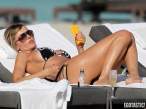 rita-rusic-black-bikini-tanning-miami-05-580x435.jpg