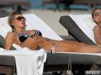 rita-rusic-black-bikini-tanning-miami-12-580x435.jpg