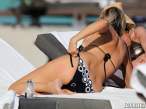 rita-rusic-black-bikini-tanning-miami-14-580x435.jpg